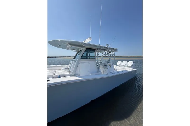 Slide: The Image of Onslow Bay 37 Tournament Edition 2026 boat on calm water under clear sky. - 31
