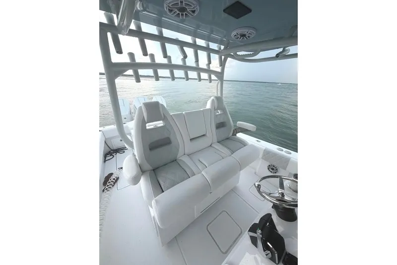 Slide: The Image of 2026 Onslow Bay 37 Tournament Edition boat interior with luxurious seating and ocean view. - 53