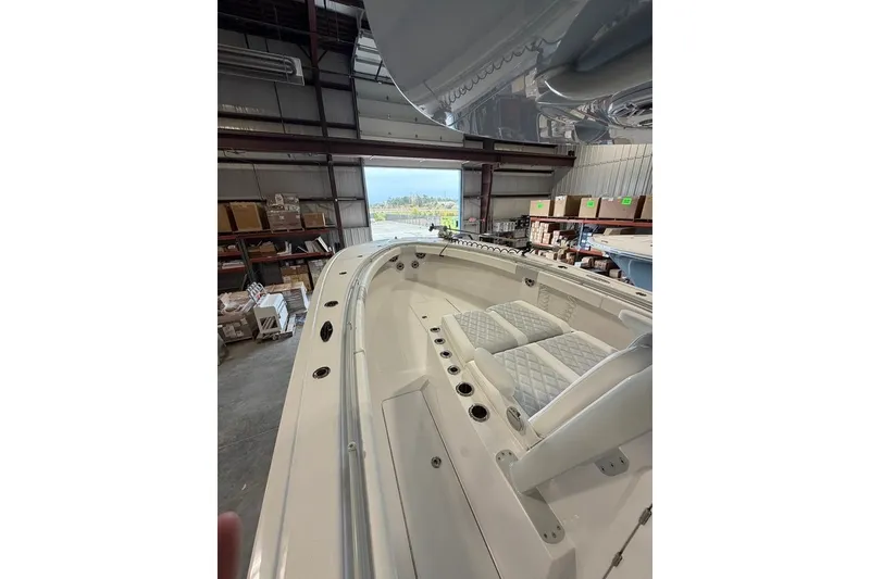 Slide: The Image of 2026 Onslow Bay 37 Tournament Edition boat interior in a warehouse setting. - 86