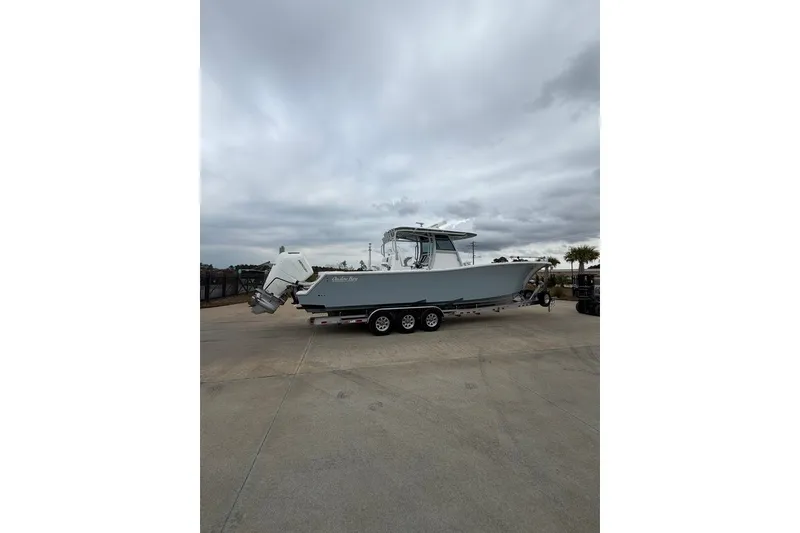 Slide: The Image of 2026 Onslow Bay 37 Tournament Edition boat on trailer under cloudy sky. - 99