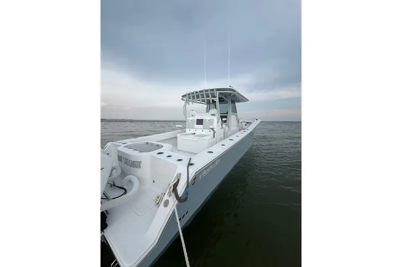 Slide: The Image of 2026 Onslow Bay 37 Tournament Edition boat on calm water under cloudy sky. - 48