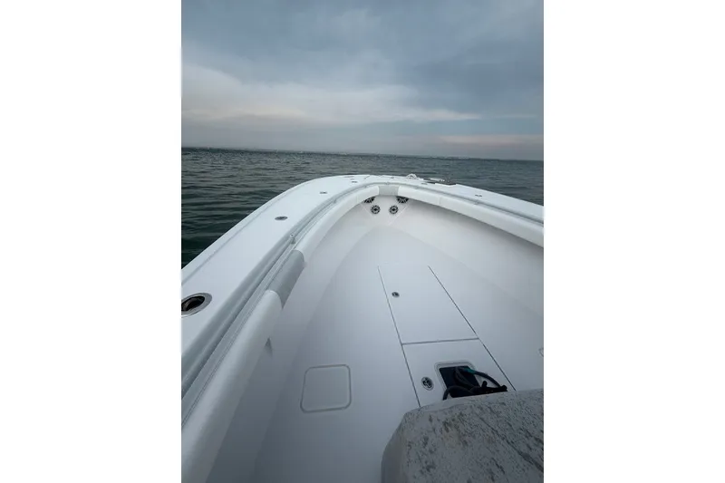 Slide: The Image of Onslow Bay 37 Tournament Edition 2026 boat on calm ocean waters under cloudy sky. - 64