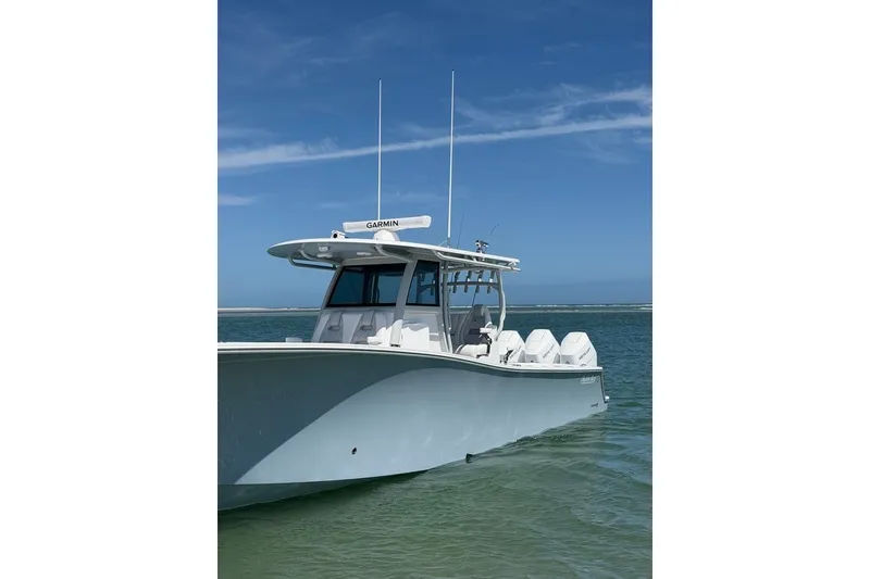 Slide: The Image of 2026 Onslow Bay 37 Tournament Edition boat on calm water under clear blue sky. - 41