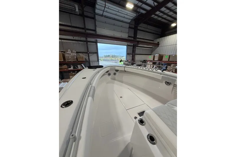 Slide: The Image of 2026 Onslow Bay 37 Tournament Edition boat interior in a warehouse setting. - 74