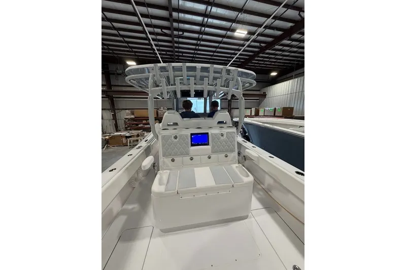 Slide: The Image of 2026 Onslow Bay 37 Tournament Edition boat interior in a warehouse setting. - 79