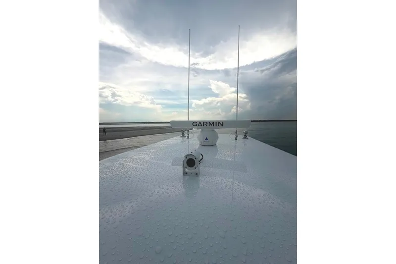 Slide: The Image of 2026 Onslow Bay 37 Tournament Edition boat with Garmin radar under cloudy sky. - 55
