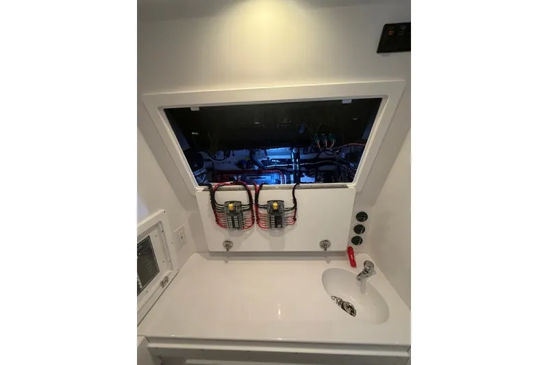 Slide: The Image of Electrical panel and sink in 2026 Onslow Bay 37 Tournament Edition boat. - 26