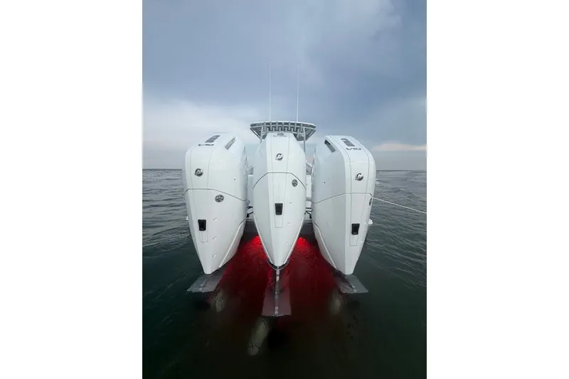 Slide: The Image of 2026 Onslow Bay 37 Tournament Edition boat with triple outboard engines on water. - 46