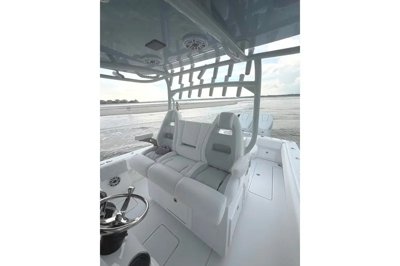 Slide: The Image of 2026 Onslow Bay 37 Tournament Edition boat interior with sleek seating and ocean view. - 56