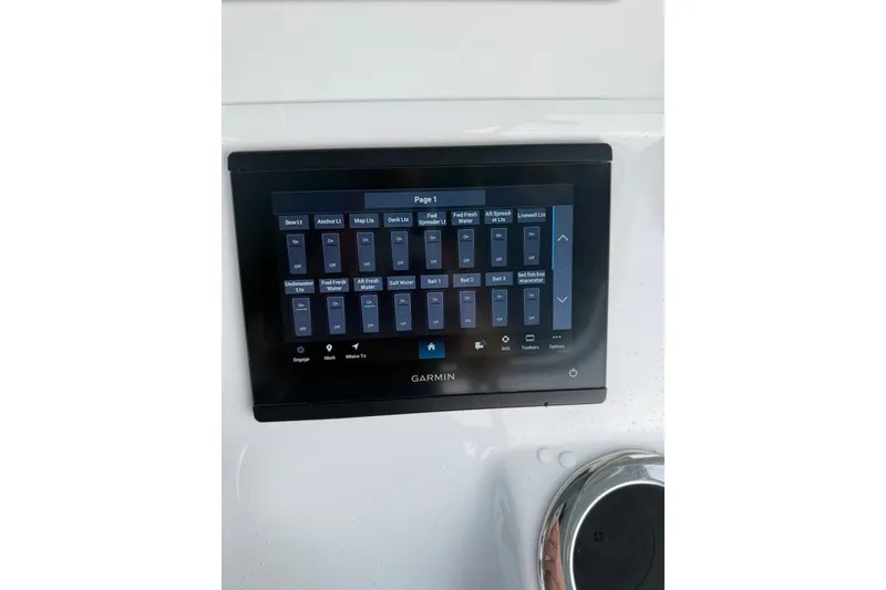 Slide: The Image of Garmin control panel on 2026 Onslow Bay 37 Tournament Edition boat dashboard. - 62