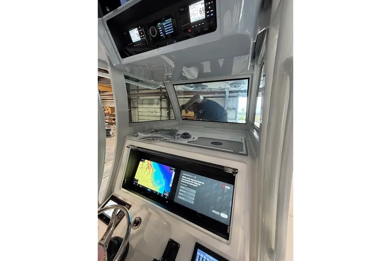 Slide: The Image of 2026 Onslow Bay 37 Tournament Edition boat cockpit with advanced navigation displays. - 93