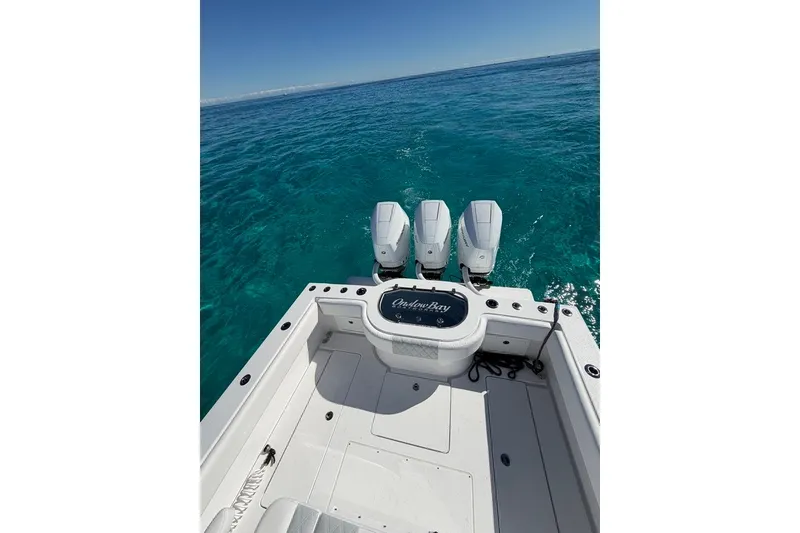 Slide: The Image of 2026 Onslow Bay 37 Tournament Edition boat on clear blue water. - 125