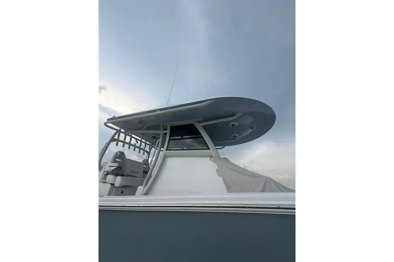 Slide: The Image of 2026 Onslow Bay 37 Tournament Edition boat with sleek design under cloudy sky. - 50