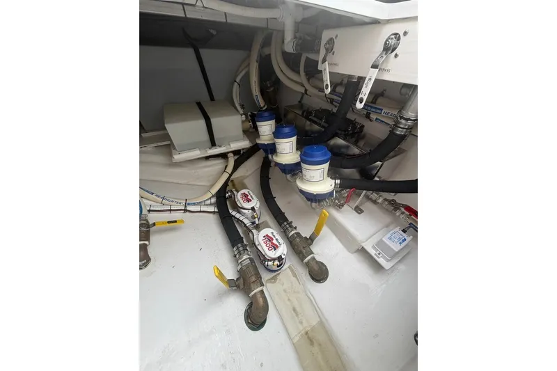 Slide: The Image of Engine compartment of 2026 Onslow Bay 37 Tournament Edition with hoses and valves. - 69