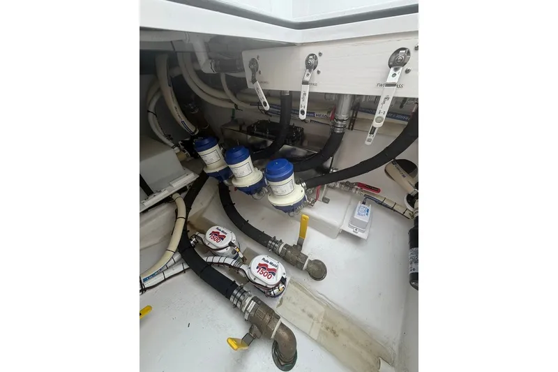 Slide: The Image of Bilge area of 2026 Onslow Bay 37 Tournament Edition boat with pumps and hoses. - 68