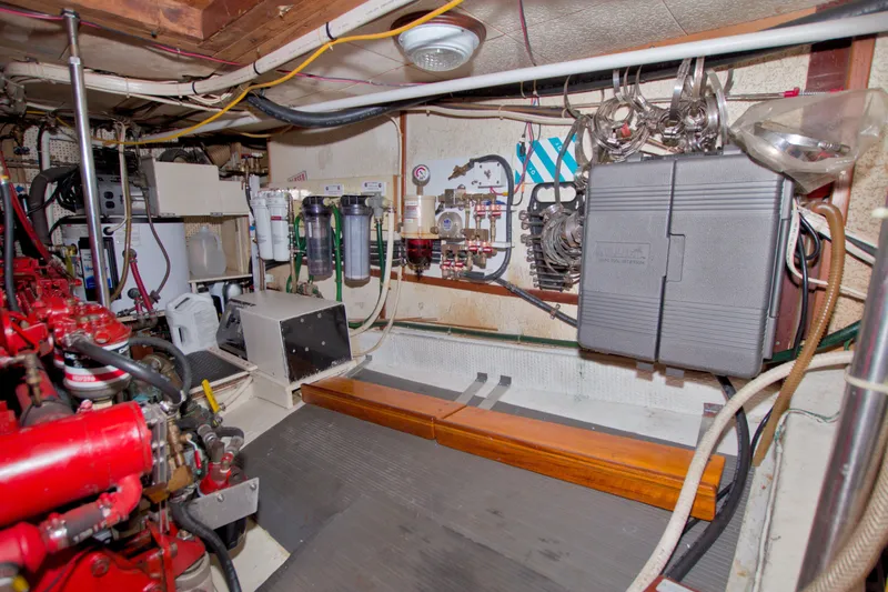 Slide: The Image of Engine room of a 1980 Kadey-Krogen 42 boat, showcasing mechanical systems and equipment. - 88