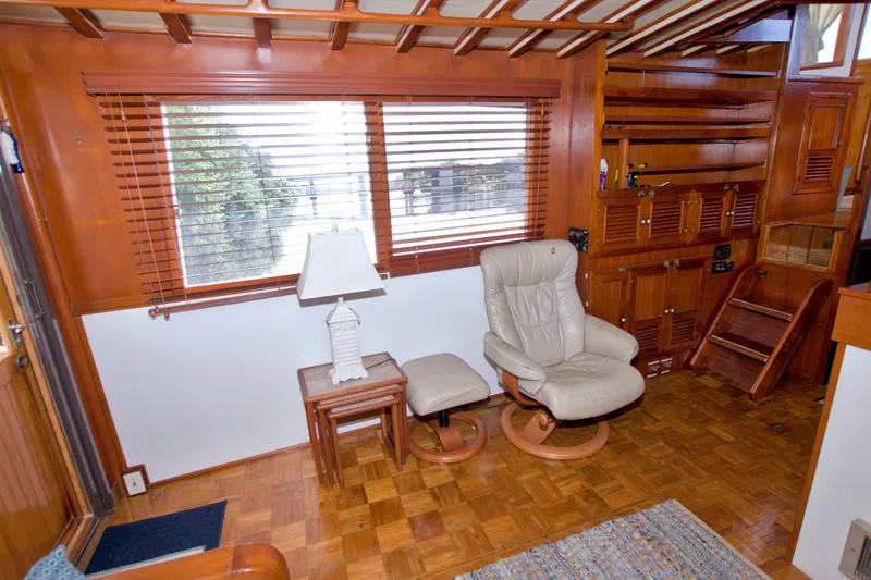 Slide: The Image of Interior of 1980 Kadey-Krogen 42 yacht with wooden paneling and comfortable seating. - 40