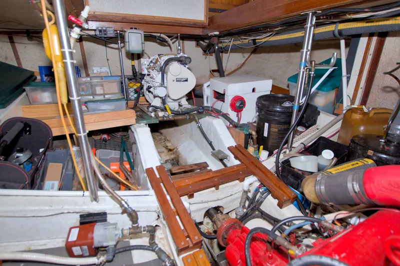 Slide: The Image of Engine room of a 1980 Kadey-Krogen 42 boat, showcasing equipment and storage. - 94