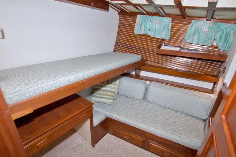 Slide: The Image of Cozy cabin interior of 1980 Kadey-Krogen 42 with bunk beds and wooden furnishings. - 62