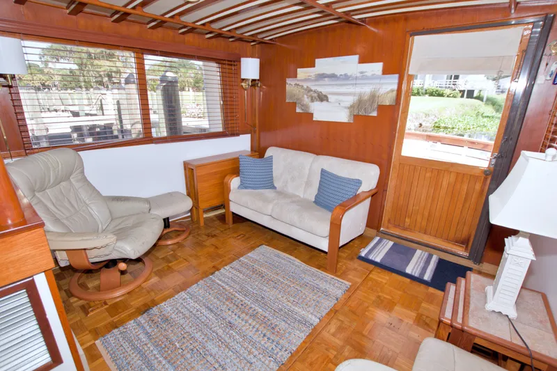 Slide: The Image of Cozy interior of a 1980 Kadey-Krogen 42 yacht with comfortable seating and nautical decor. - 39
