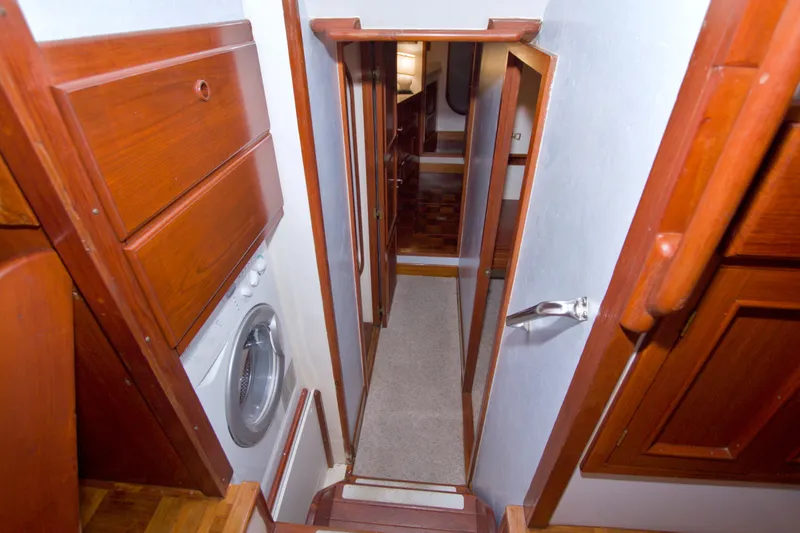 Slide: The Image of Interior of 1980 Kadey-Krogen 42 yacht with wooden cabinetry and washing machine. - 60