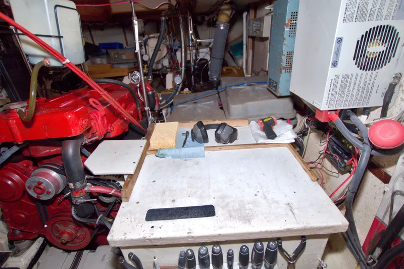 Slide: The Image of Engine room of a 1980 Kadey-Krogen 42 boat with tools and equipment. - 81