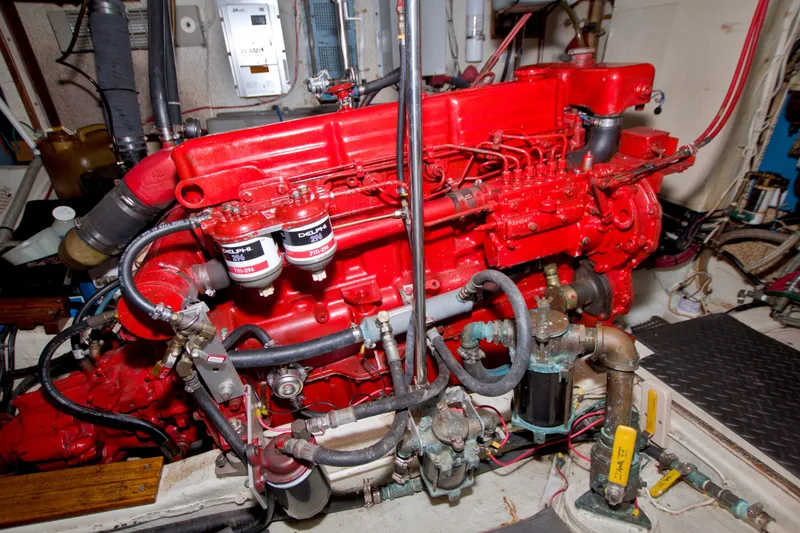 Slide: The Image of Red engine of a 1980 Kadey-Krogen 42 boat, featuring detailed mechanical components. - 93