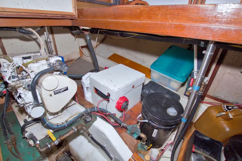 Slide: The Image of Engine room of a 1980 Kadey-Krogen 42 boat with mechanical components. - 95