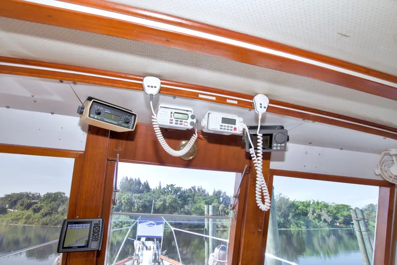 Slide: The Image of Interior view of 1980 Kadey-Krogen 42 boat with navigation equipment and scenic waterway. - 52