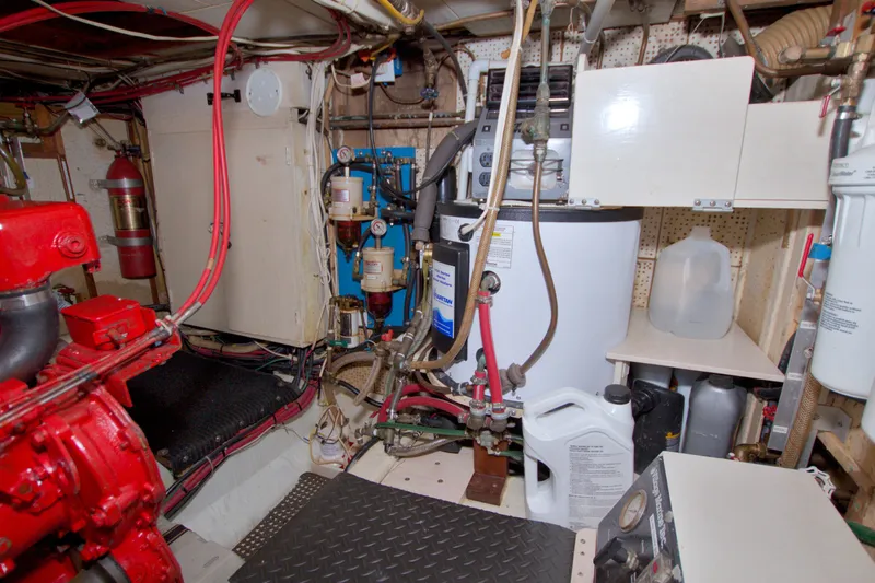 Slide: The Image of Engine room of a 1980 Kadey-Krogen 42 boat with machinery and equipment. - 90