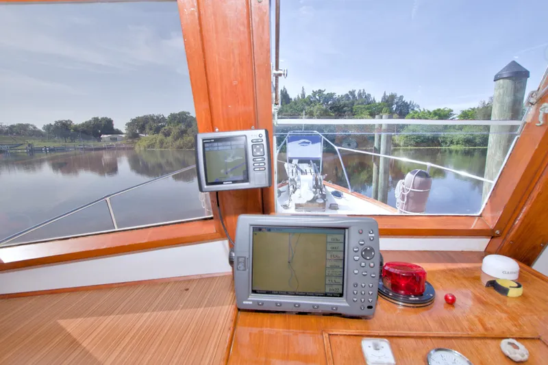 Slide: The Image of Interior view of 1980 Kadey-Krogen 42 boat with navigation equipment and scenic waterway. - 53