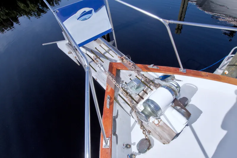 Slide: The Image of Bow of 1980 Kadey-Krogen 42 yacht with anchor chain and winch system. - 29