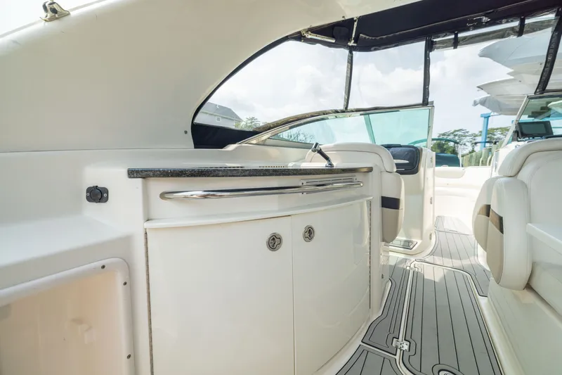 Slide: The Image of Interior view of 2011 Chaparral 287 SSX boat, featuring sleek cabinetry and seating. - 14