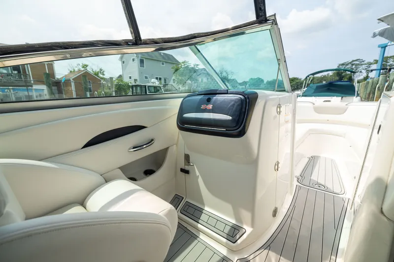 Slide: The Image of 2011 Chaparral 287 SSX boat interior with sleek seating and modern design. - 17