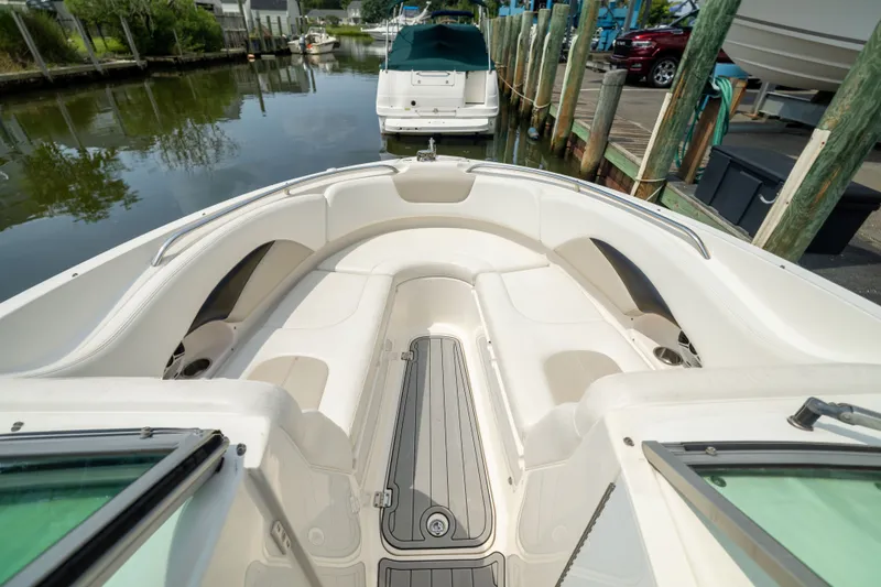 Slide: The Image of 2011 Chaparral 287 SSX boat interior with white seating and sleek design. - 19