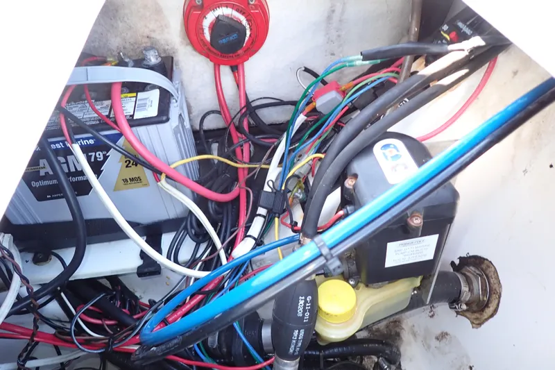 Slide: The Image of Electrical wiring and battery setup in a 2015 Blue Wave 2400 PureBay boat. - 75