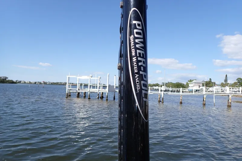 Slide: The Image of Power-Pole shallow water anchor on Blue Wave 2400 PureBay, 2015, near docks and calm water. - 80
