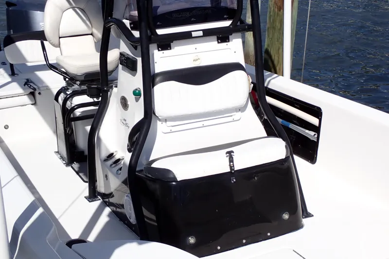 Slide: The Image of 2015 Blue Wave 2400 PureBay boat interior with seating and console details. - 13