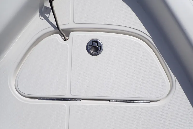 Slide: The Image of Hatch detail of 2015 Blue Wave 2400 PureBay boat, featuring a sleek, textured design. - 39