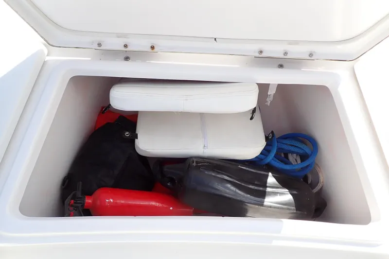Slide: The Image of Storage compartment of 2015 Blue Wave 2400 PureBay boat with equipment and accessories. - 42