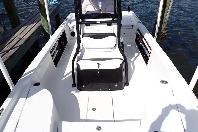 Slide: The Image of 2015 Blue Wave 2400 PureBay boat interior, featuring spacious seating and sleek design. - 18