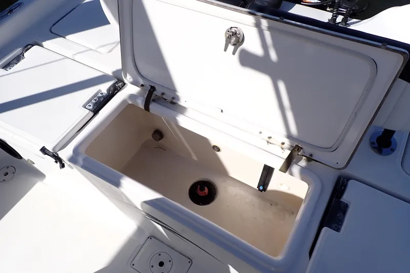 Slide: The Image of Open storage compartment on a 2015 Blue Wave 2400 PureBay boat. - 67
