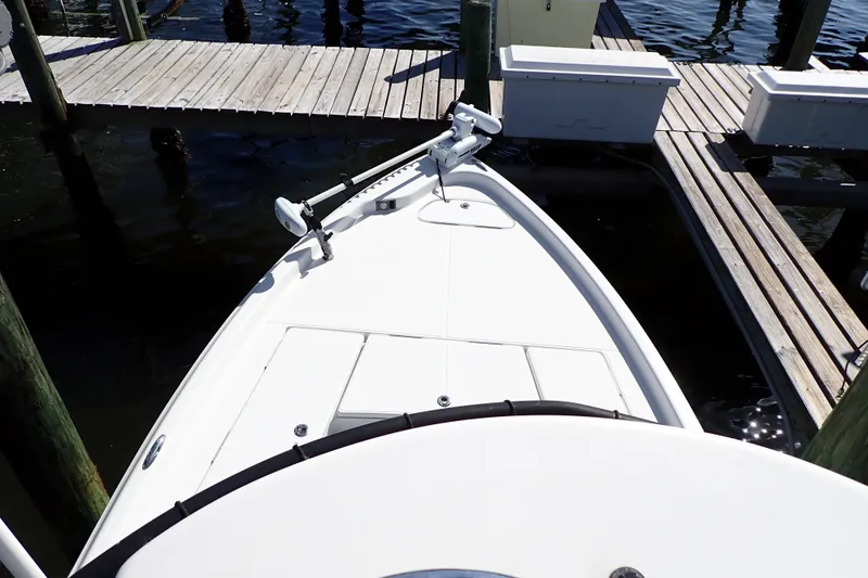 Slide: The Image of 2015 Blue Wave 2400 PureBay boat docked at a wooden pier. - 91