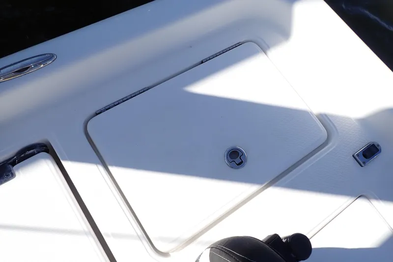 Slide: The Image of 2015 Blue Wave 2400 PureBay boat deck with storage compartment and latch. - 78
