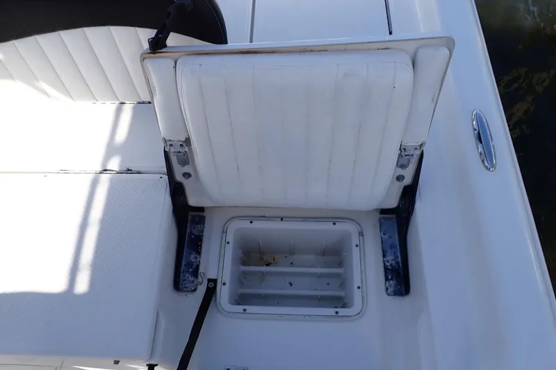 Slide: The Image of 2015 Blue Wave 2400 PureBay boat seat with storage compartment open. - 70
