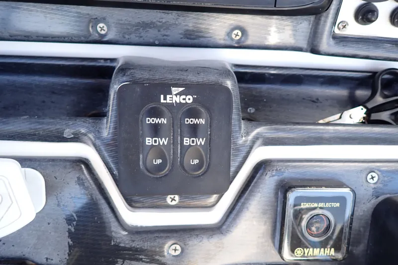 Slide: The Image of Control panel of a 2015 Blue Wave 2400 PureBay boat with Lenco trim tab switches. - 27
