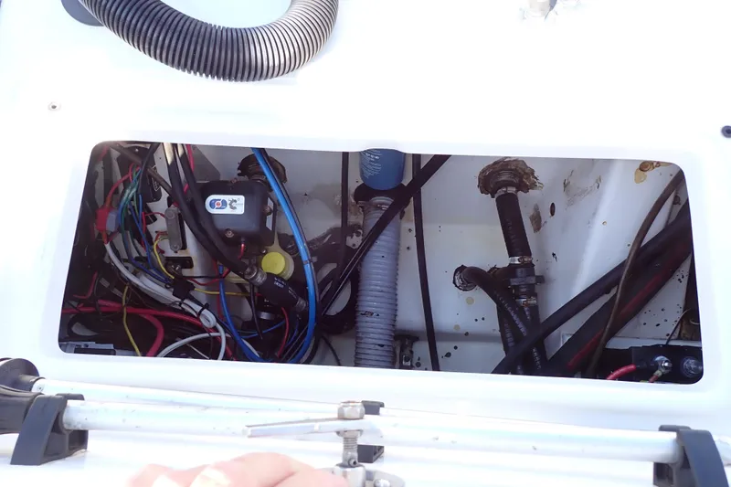Slide: The Image of 2015 Blue Wave 2400 PureBay boat wiring and plumbing compartment. - 74