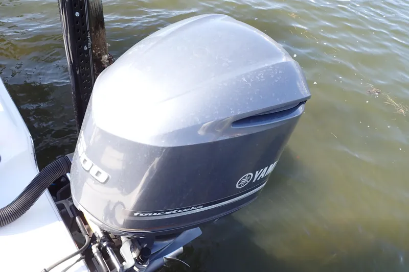 Slide: The Image of 2015 Blue Wave 2400 PureBay boat with Yamaha outboard motor on water. - 83