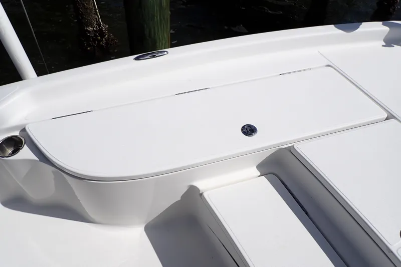 Slide: The Image of 2015 Blue Wave 2400 PureBay boat deck with storage compartment and cup holder. - 45