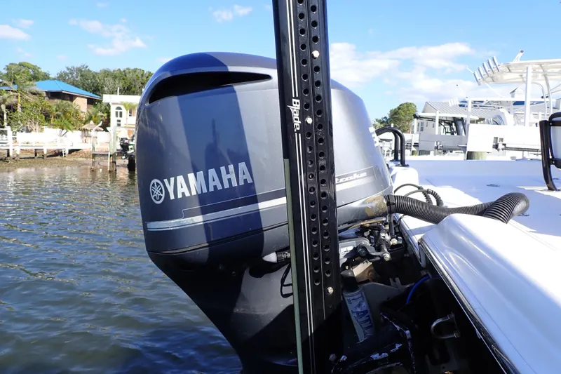 Slide: The Image of 2015 Blue Wave 2400 PureBay boat with Yamaha outboard motor on a sunny day. - 98
